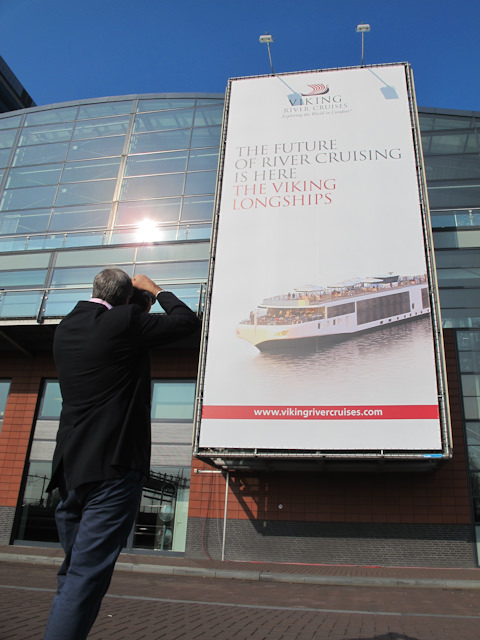 The Big Day: An Avid Cruiser photographs the enormous banner outside the Port Terminal Amsterdam for the christening of the Viking Longships. Photo © 2012 Aaron Saunders
