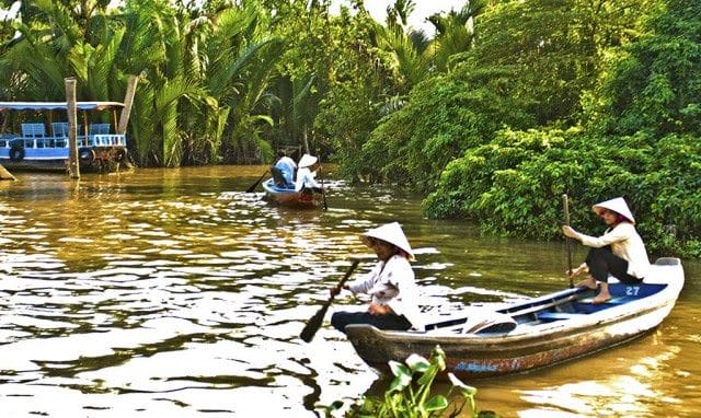 Boatwomen on the Mekong Delta A view of boats on the Mekong Delta in Vietnam