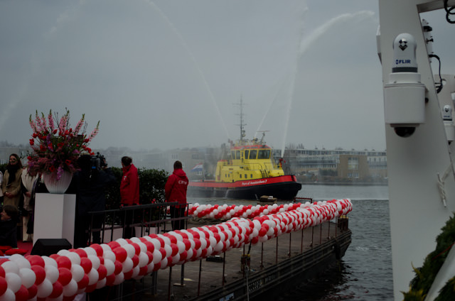 It Is Done! Water cannons from a nearby fireboat fill the air with water as the sounds of six Viking Longships horns blares across Amsterdam. Photo © 2013 Aaron Saunders