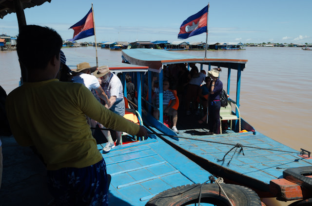 Passengers from the AmaLotus prepare to disembark our local skiffs. Photo © 2013 Aaron Saunders