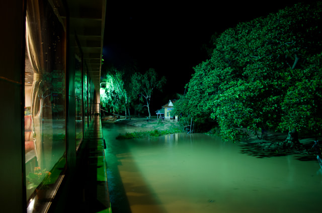 Our night anchorage at Kampong Tralach, Cambodia. Kids were still out splashing and playing by the ship, even at 10pm. Photo © 2013 Aaron Saunders