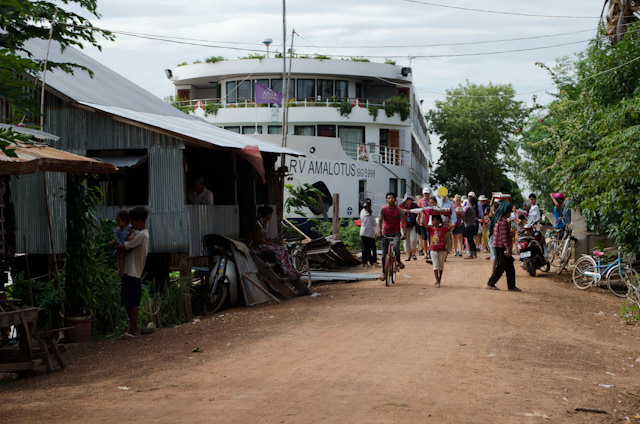 The arrival of the AmaLotus - which towered over Coh Chen - was an event for passengers and residents alike. Photo © 2013 Aaron Saunders
