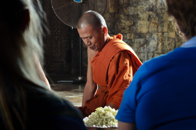Monks bestowed a traditional Buddhist blessing on the guests of the AmaLotus - a truly unique experience! Photo © 2013 Aaron Saunders