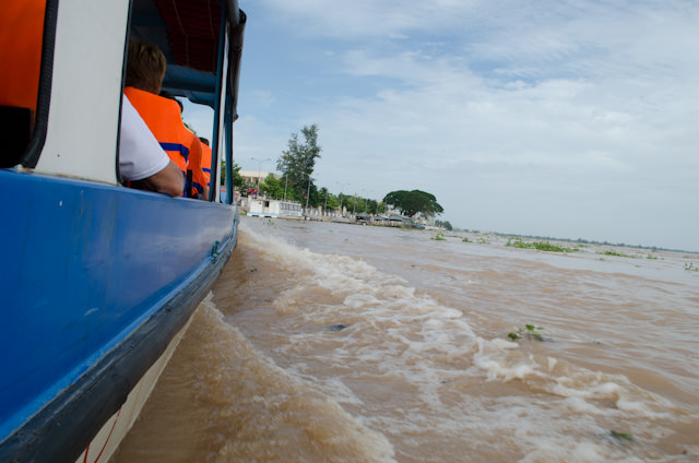 Exploring the Mekong by motorized boat, en-route to a walking tour of a small local village. Photo © 2013 Aaron Saunders