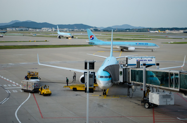 My flight to Siem Reap waiting at Gate 18 in Seoul, South Korea. Photo © 2013 Aaron Saunders