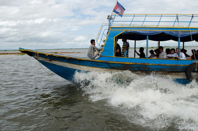 Our journey to the AmaLotus took us past boats of all shapes and sizes, some of which travel faster than others! Photo © 2013 Aaron Saunders