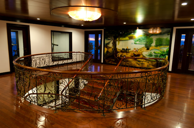 Throughout the ship, an attractive and inviting design is present. This is the Sun Deck landing of the main Atrium staircase. Photo © 2013 Aaron Saunders