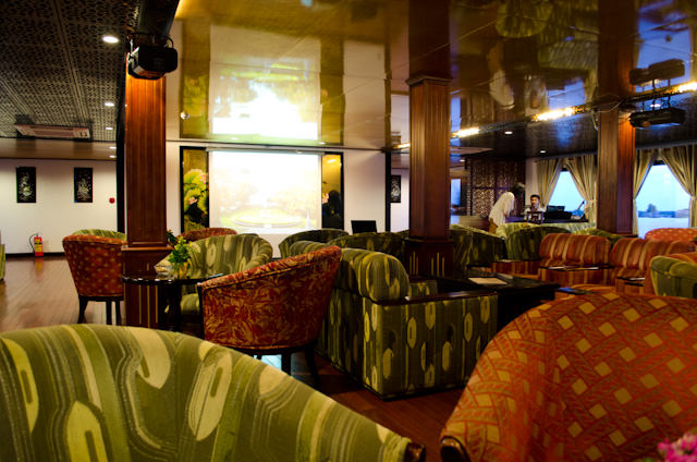 The inviting Saigon Lounge is the main social hub aboard the AmaLotus. This photo was taken facing the forward, starboard-side of the lounge. Photo © 2013 Aaron Saunders
