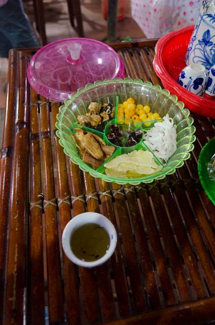 Enjoying jasmine tea and some treats before heading back into the rain! Photo © 2013 Aaron Saunders