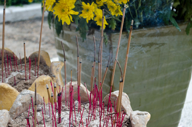 Visitors can pay their respects to the victims with flowers and burning incense. Photo © 2013 Aaron Saunders