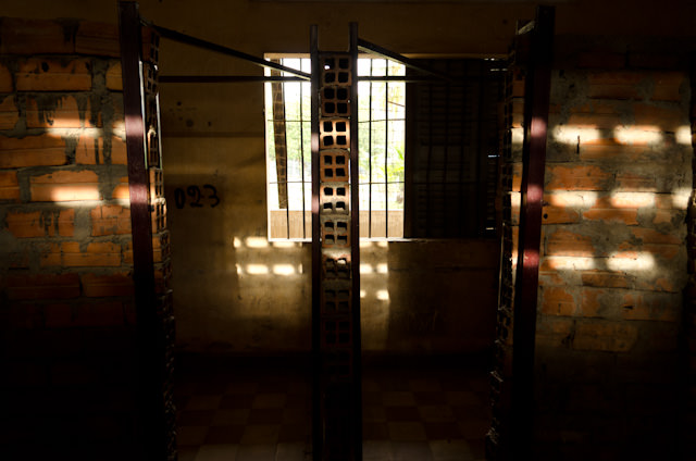 Standing between two prison cells in S-21. Photo © 2013 Aaron Saunders