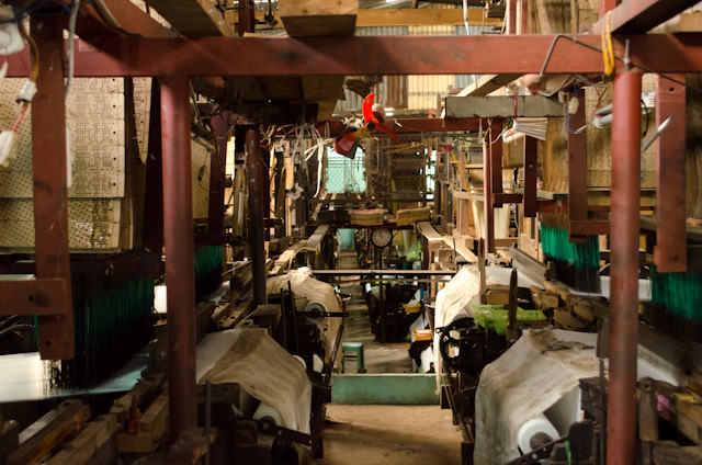 Row after row of looms at the silk weaving factory in Tan Chau. Photo © 2013 Aaron Saunders