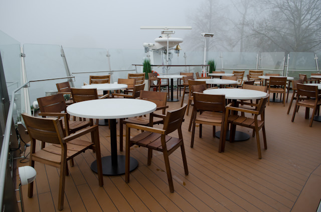 Outdoor seating may not be used much on this voyage, but it is still available. Photo © 2013 Aaron Saunders