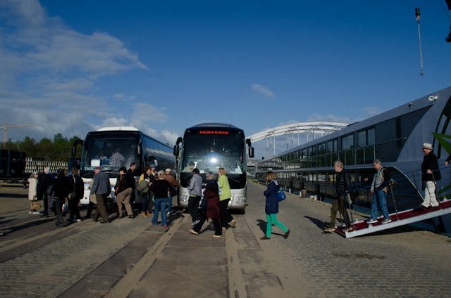 Guests disembark Tauck's MS Inspire and head to their motorcoaches. Booking transfers to and from the ship can be a real time-saver. Photo © 2014 Aaron Saunders