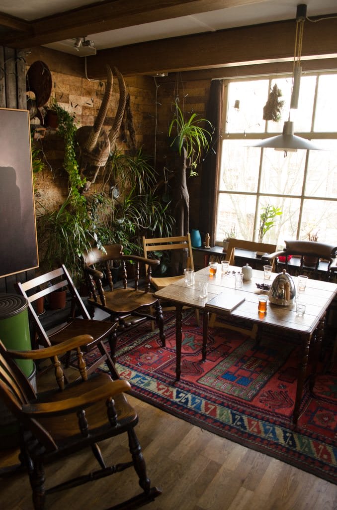 His living room is directly adjacent to the kitchen. Space is tight, but we all manage to sit around a small table - and admire his view. Photo © 2015 Aaron Saunders