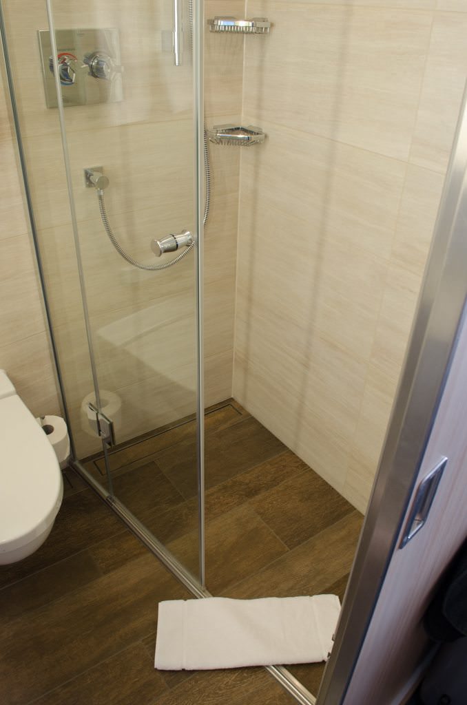 Stateroom shower. Note the new flooring style and the new, easy-to-understand controls. Photo © 2015 Aaron Saunders