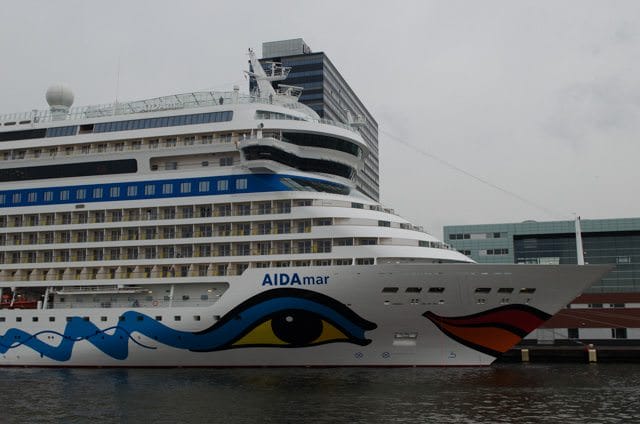 AIDA Cruises' AIDAmar docked at the Passenger Terminal Amsterdam - just half a block from the river cruise ship docks. Photo © 2015 Aaron Saunders