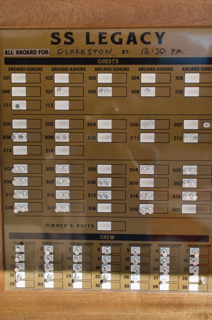 Guests aboard the S.S. Legacy use a simple peg-board style system to mark themselves as "Onboard" or "Ashore". Don't forget to move your peg! Photo © 2015 Aaron Saunders