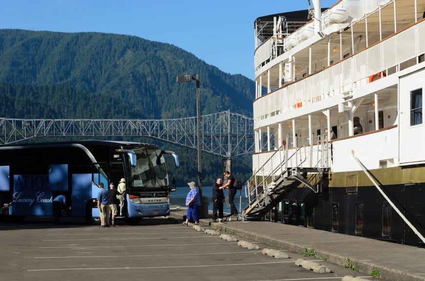 Guests disembark S.S. Legacy and board our luxury National Coach (locally-operated and based in Portland) for a day of touring ashore. Photo © 2015 Aaron Saunders