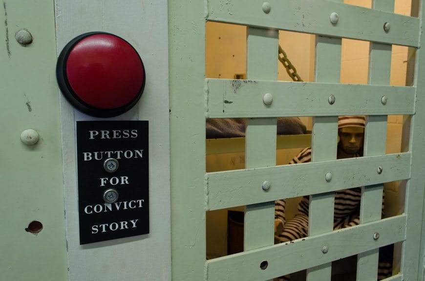 Push the button and make the convict talk! For kids, it was more convincing: one kid in the room during our visit peered hesitantly through the bars before asking his dad, "Is he real? Are you real?" Photo © 2015 Aaron Saunders
