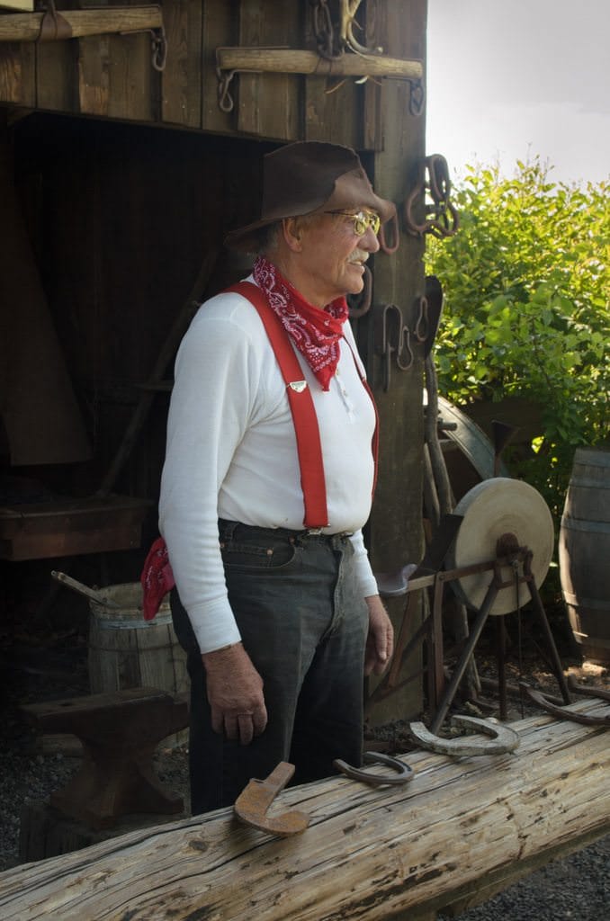 This chap, at the Blacksmith's shop, really knew his stuff. He'd attracted quite a crowd of onlookers eager to hear his stories. Photo © 2015 Aaron Saunders