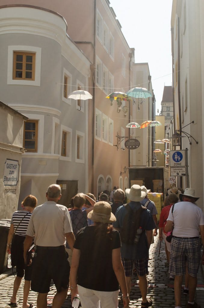 Strolling Passau's Art District. The umbrellas are part of an art installation that will remain up until Christmas, when they are auctioned off with the proceeds going to charity. Photo © 2015 Aaron Saunders