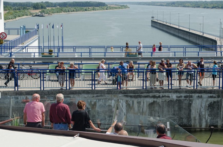 Observers watch from the road as we are lowered 20 metres down in order to continue our journey. Photo © 2015 Aaron Saunders