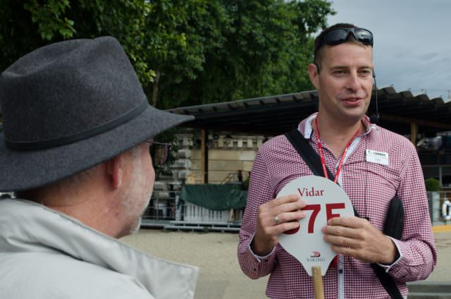 Our local guide met us pierside for our walking tour of Budapest that would use only our feet and Public Transit. Best of all, it was offered complimentary by Viking. Photo © 2015 Aaron Saunders