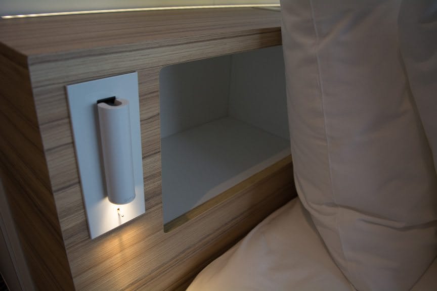 Plenty of clever storage spaces, like these ones behind your pillow, are included. Photo © 2016 Aaron Saunders