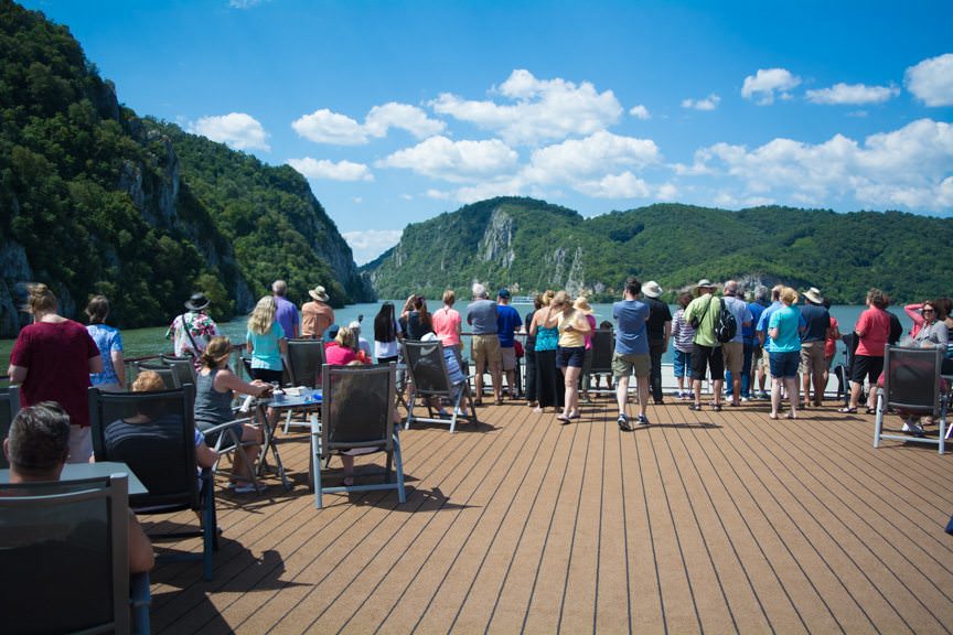Guests crowd the forward Sun Deck as Viking Embla enters the Iron Gates...Photo © 2016 Aaron Saunders