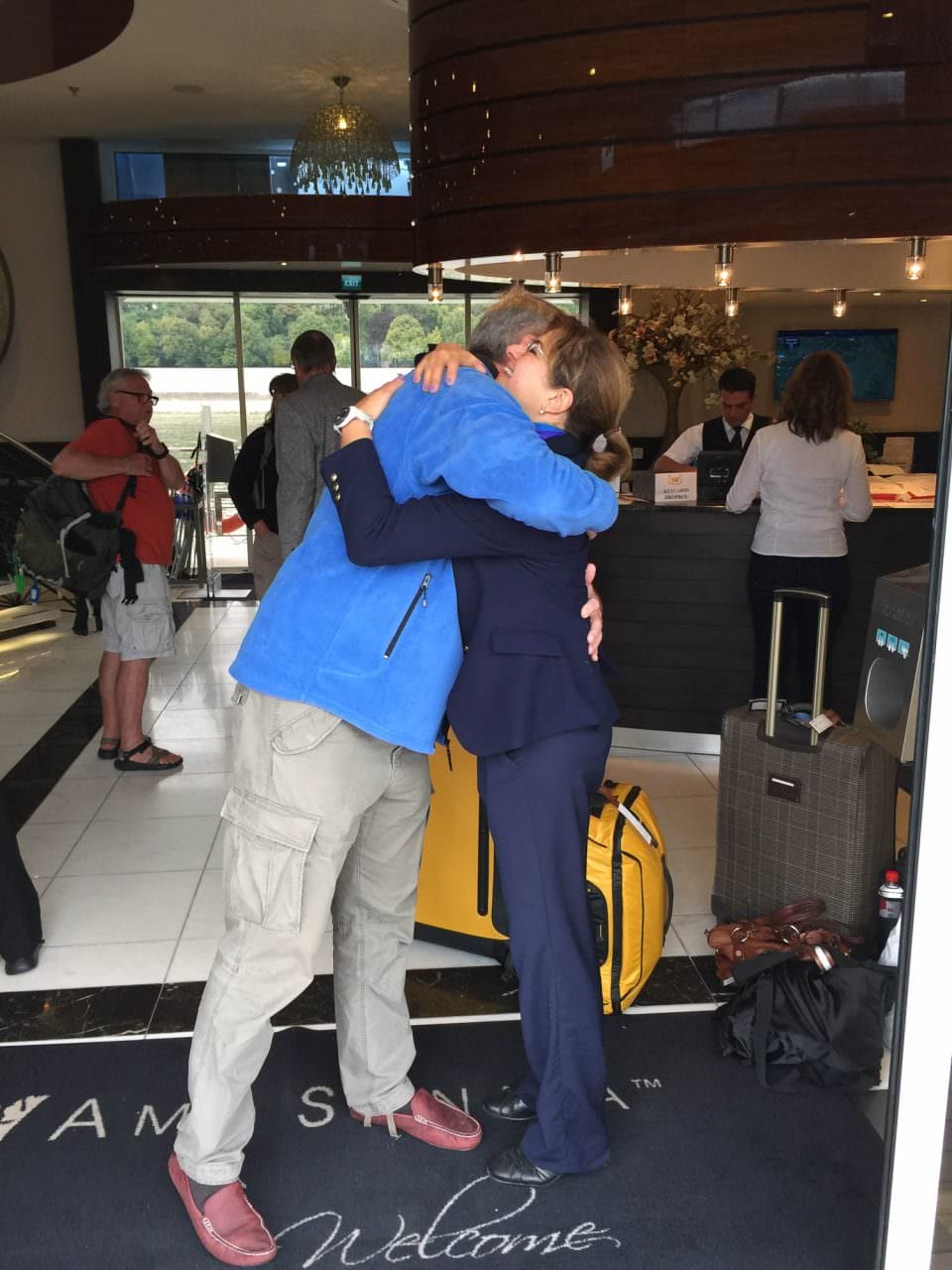 Hugs, tears and good-byes. © 2016 Ralph Grizzle